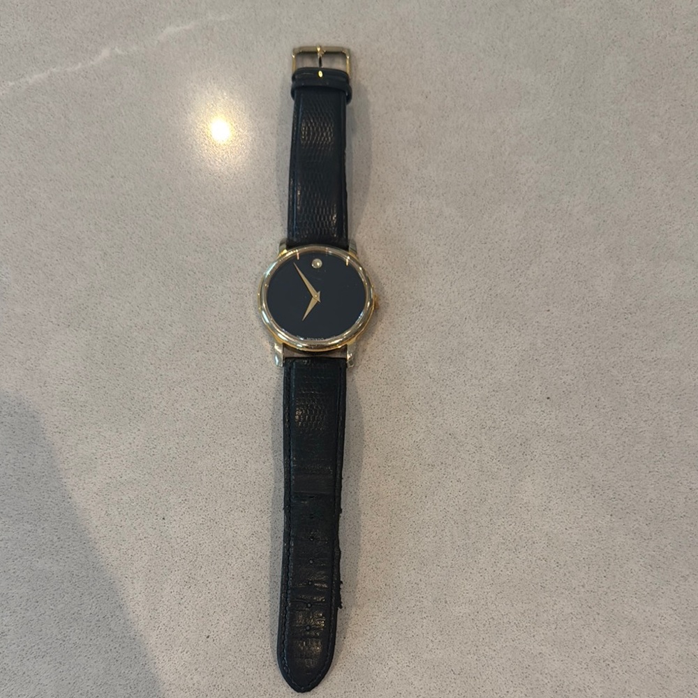 Movado Women's Watch with Black and Gold Design